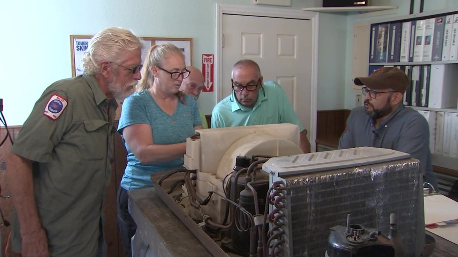 Students at RV Tech Training Center work on machine. 