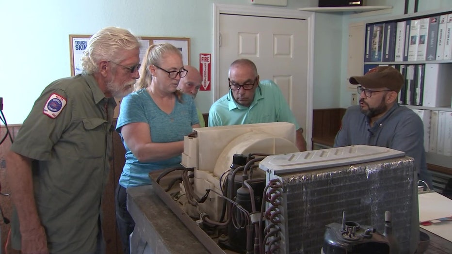 Students at RV Tech Training Center work on machine.