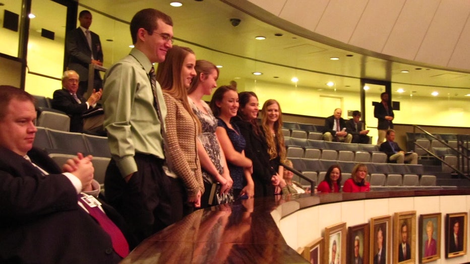 Tony Pirotta and students in auditorium. 