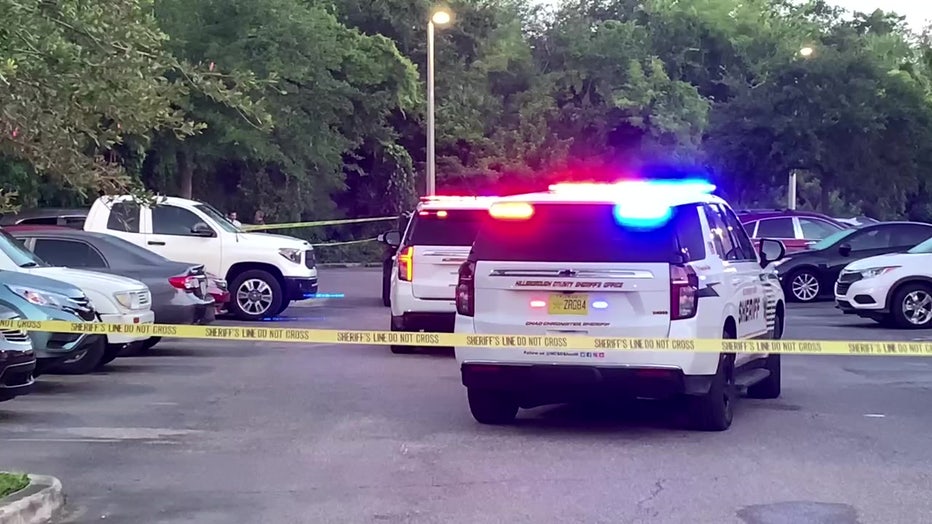 Law enforcement officers and cars outside Tampa apartment complex were a suspect was shot and killed by deputies.