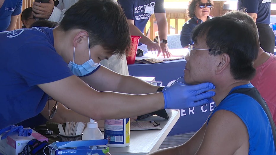 Woman getting skin cancer screening