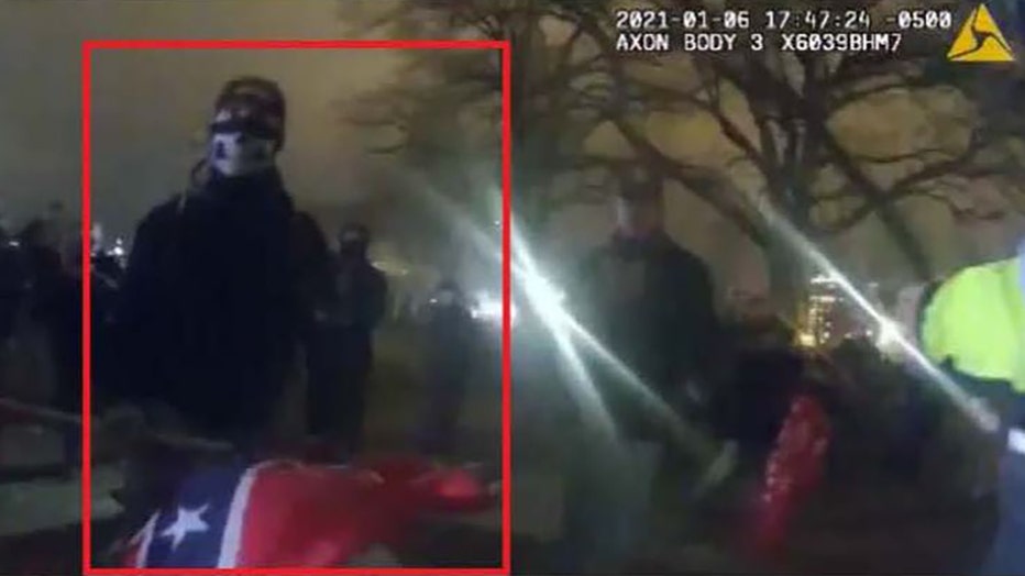 Photo: David Alan Blair seen in an officer's body cam video with a Confederate flag on Jan. 6, 2021.
