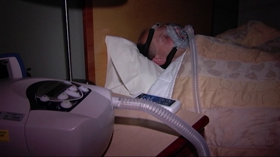 Photo: CPAP machine on someone in bed