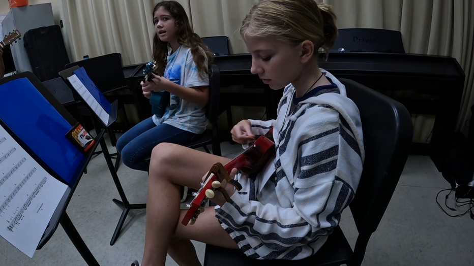 Photo: Kids taking a ukulele class