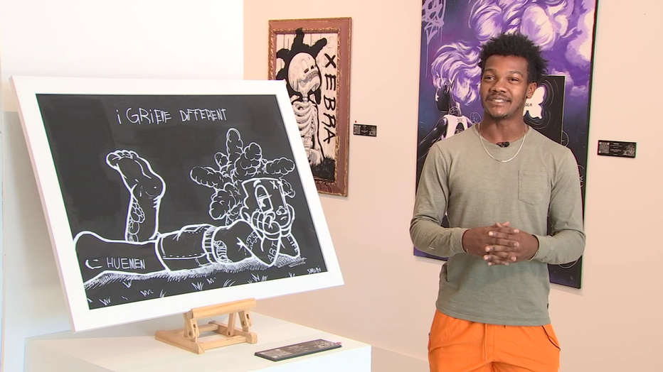 Photo: Jabari Reed-Diop with his artwork.