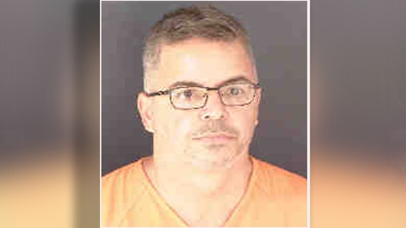 Armed man accused of killing girlfriend 2 days after domestic battery arrest dies after threatening deputy