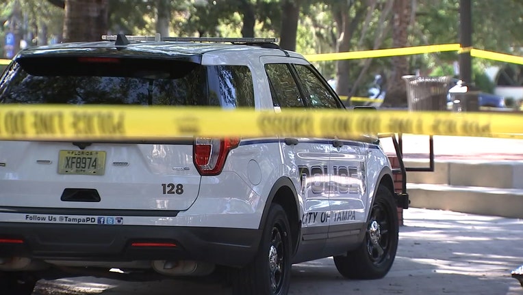 Photo: Crime scene tape and a Tampa police patrol vehicle at Centennial Park.