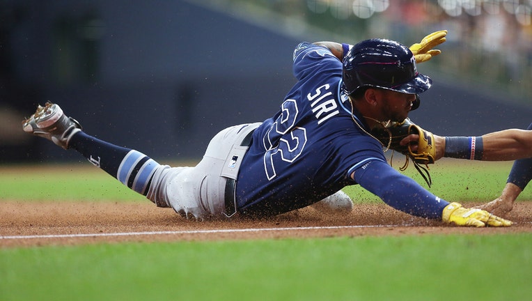 Tampa Bay Rays center fielder Jose Siri (22) is unable to avoid the tag of Milwaukee Brewers third baseman Luis Urias 