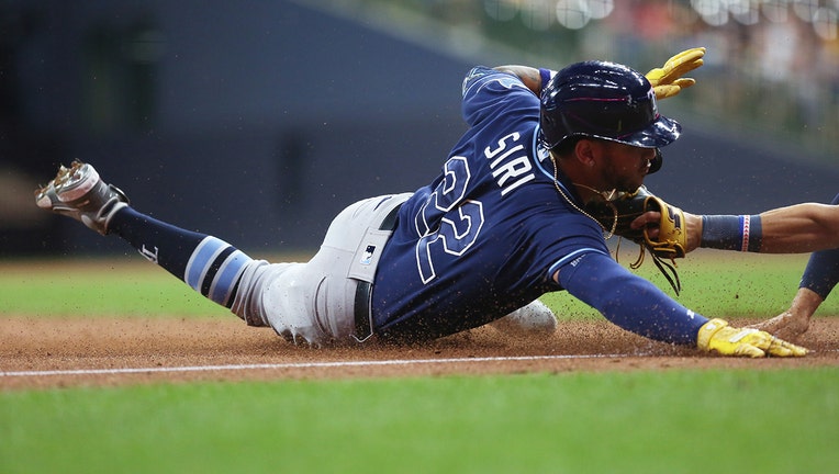 Tampa Bay Rays center fielder Jose Siri (22) is unable to avoid the tag of Milwaukee Brewers third baseman Luis Urias
