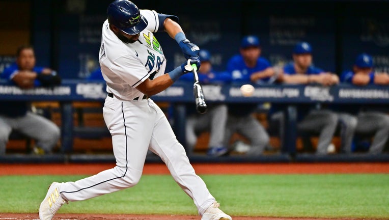 Manuel Margot #13 of the Tampa Bay Rays hits a single in the first inning against the Kansas City Royals at Tropicana Field on August 20, 2022 in St Petersburg, Florida. 