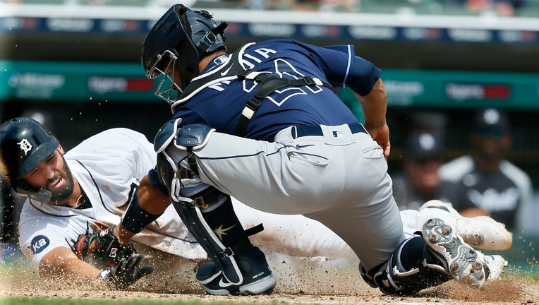 Riley Greene #31 of the Detroit Tigers is tagged out by catcher Francisco Mejia #21 of the Tampa Bay Rays while trying to score on a hit by Javier Baez during the fourth inning Comerica Park on August 7, 2022, in Detroit, Michigan.