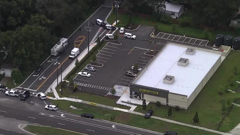 Photo: aerial view of law enforcement officers responding to Dade City officer involved shooting outside Dollar General store