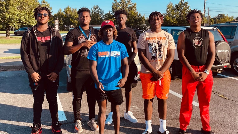 Photo: A group of Rome High School football players quickly jumped into action to help save a woman who had just been in a serious car crash.