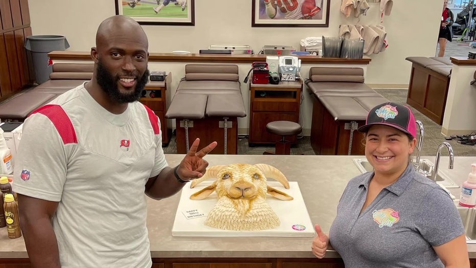 Leonard Fournette and Kristina Lavallee with GOAT cake
