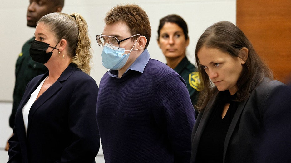 Photo: Nikolas Cruz stands as jurors enter the courtroom during the penalty phase of his trial at the Broward County Courthouse in Fort Lauderdale, Florida, on August 1, 2022.
