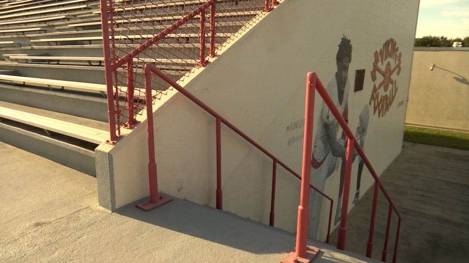 Photo: From this angle, you can see the mural is located on the wall where the football field bleachers are located