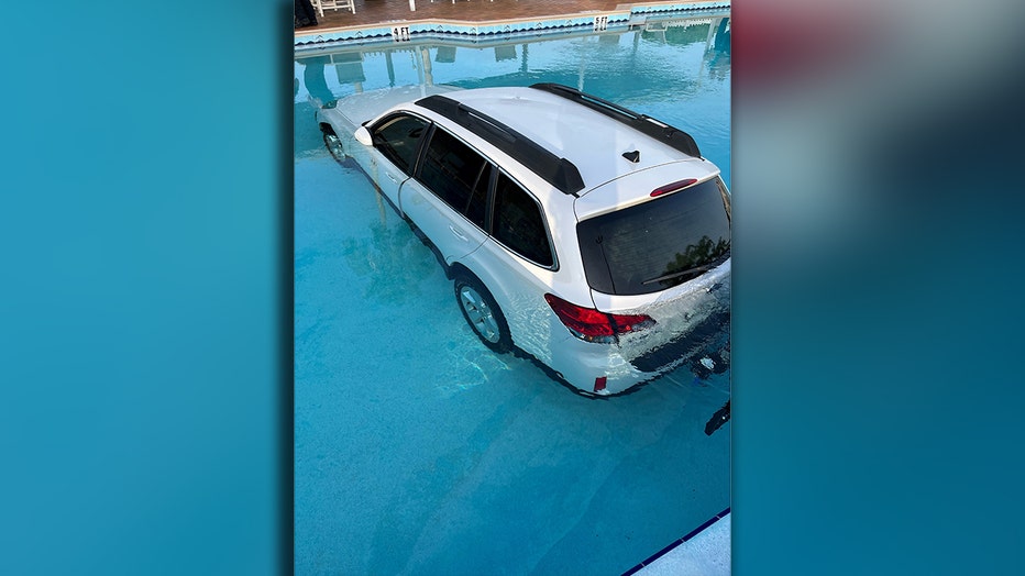 SUV dives into Lakeland pool (Courtesy Lakeland Fire Department)