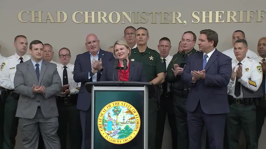 Susan Lopez with Ron DeSantis at press conference