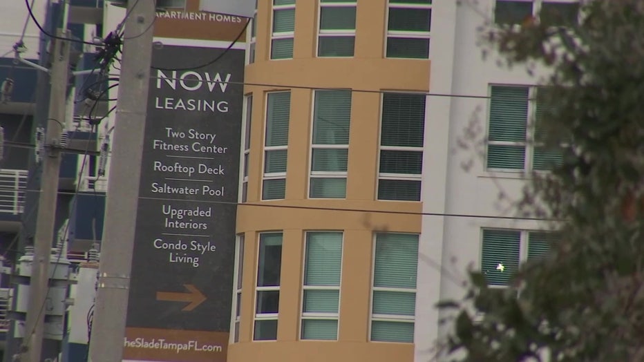 Now leasing sign in front of apartments