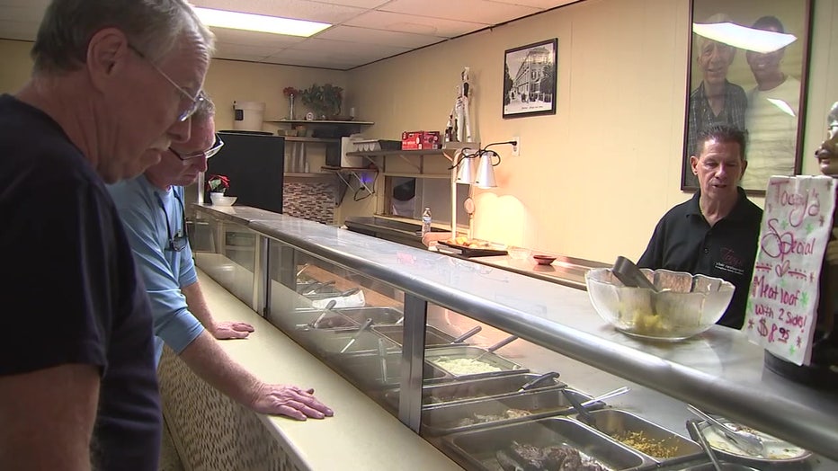 Man behind the food counter at Tony's Restaurant