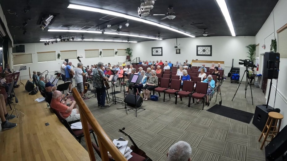 Front Porch Pickers perform for a crowd in Sun City Center. 