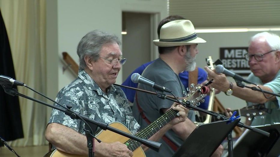 Front Porch Pickers perform for a crowd in Sun City Center. 