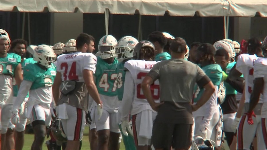 Dolphins and Buccaneers players practice ahead of Saturday's game. 