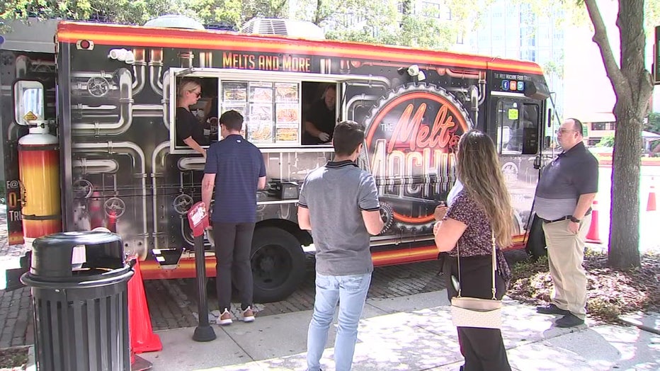 Melt Machine food truck with customers outside.