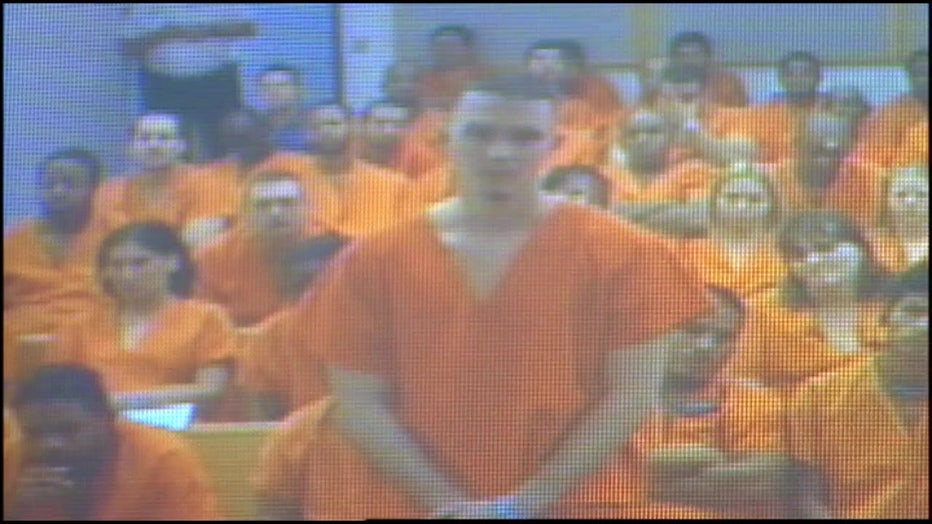 John Templeton appears in an orange jumpsuit before a judge following a fatal crash.