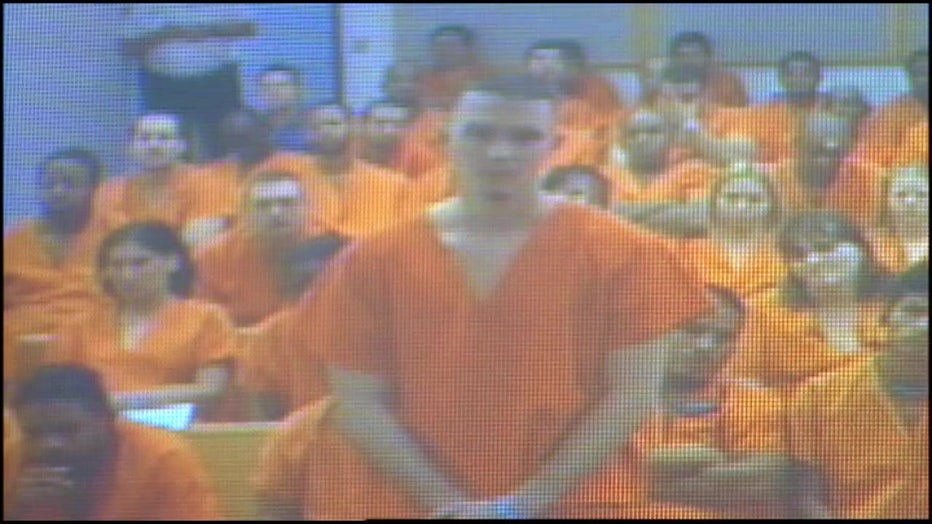 John Templeton appears in an orange jumpsuit before a judge following a fatal crash.