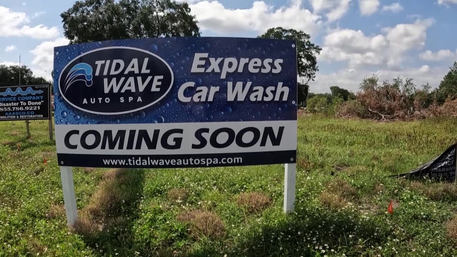 Coming soon sign for new car wash. 