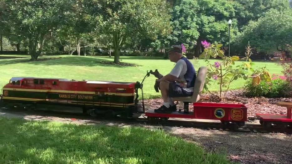 Volunteers run the rideable train in Largo Central Park. 