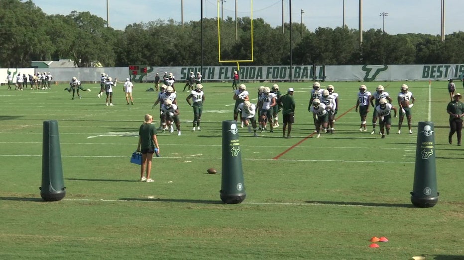 The USF football team practices with Bayron Matos, a former basketball player who walked on the team. 