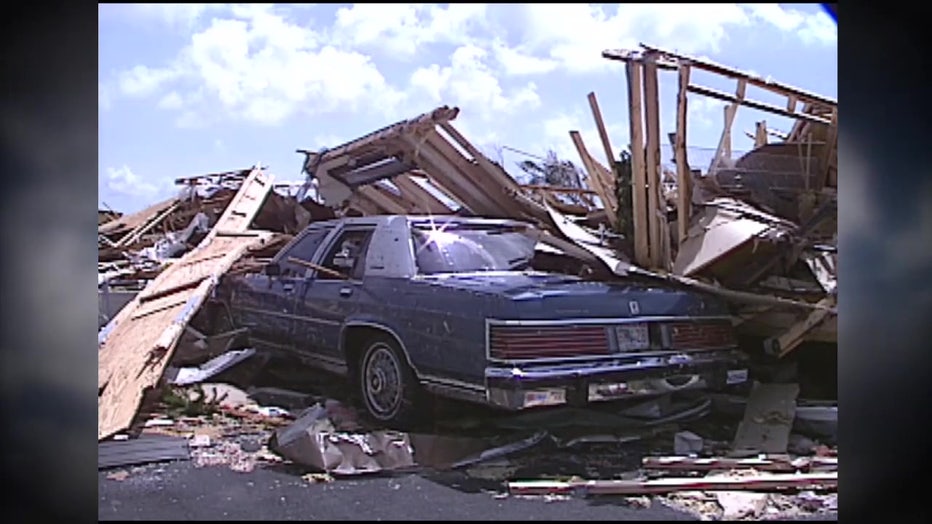 A car sits in the middle of what's left of a garage after Hurricane Andrew blew across South Florida. 