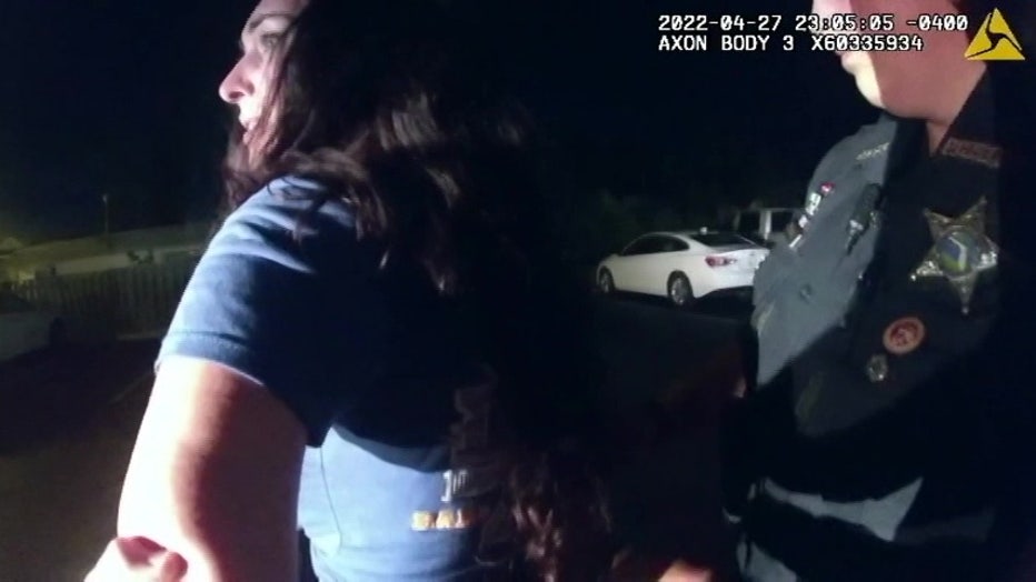 A deputy arrests Amy Harrington after she kept ignoring instructions and continued to dance along a yellow traffic line during a field sobriety test in Florida.