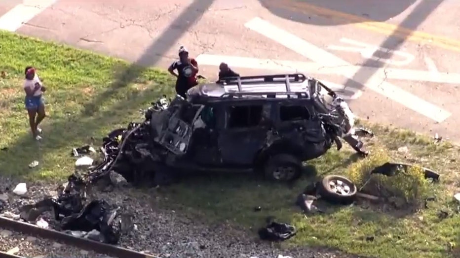 Photo: Aerial view of the mangled SUV after it was hit by a Brightline train in South Florida.