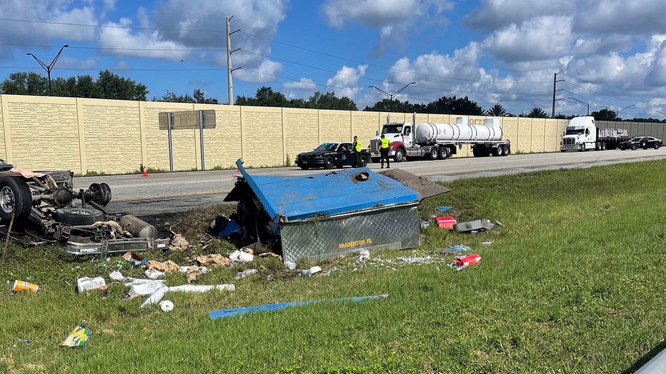 Photo: A food truck's tire blew, causing the vehicle to flip and catch fire on I-75.