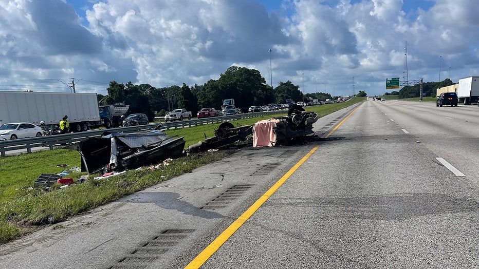 Photo: A food truck's tire blew, causing the vehicle to flip and catch fire on I-75.