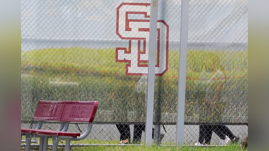Photo: Jurors walk in and around the 1200 building, the crime scene where the 2018 shootings took place, at Marjory Stoneman Douglas High School in Parkland on August 4, 2022 in Parkland, Florida. Confessed shooter Nikolas Cruz waived his right to be present at the viewing.