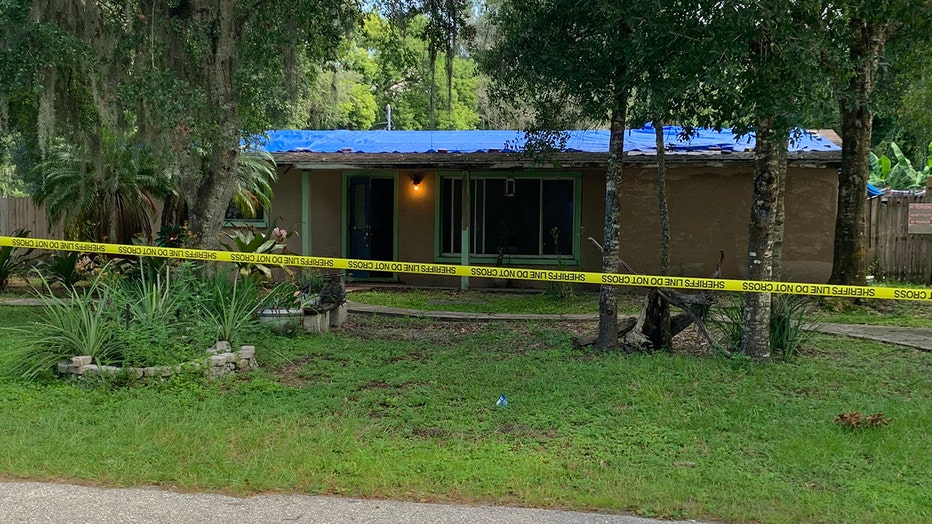 Photo: Police tape surrounds the home where a burglary suspect was shot and killed by Sarasota County deputies.