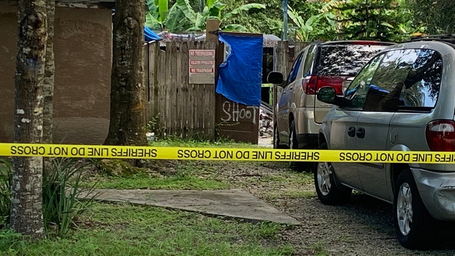 Photo: Police tape surrounds the home where a burglary suspect was shot and killed by Sarasota County deputies.