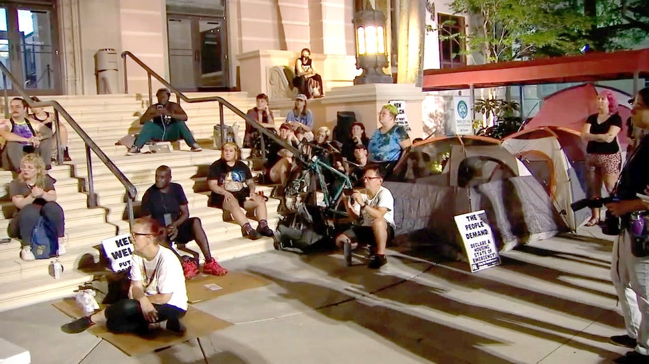 Photo: St. Pete protesters sit on the steps of City Hall overnight with tents lining the sidewalk