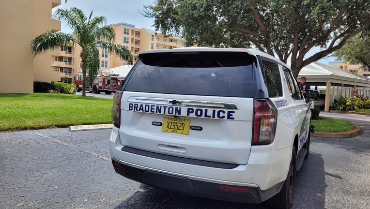 A police car sits outside a Bradenton apartment complex where one person was killed in an explosion.