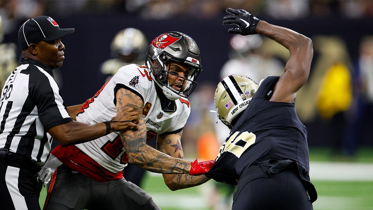 Photo: Marcus Maye #6 of the New Orleans Saints argues with Mike Evans #13 of the Tampa Bay Buccaneers on the field during the second half of the game