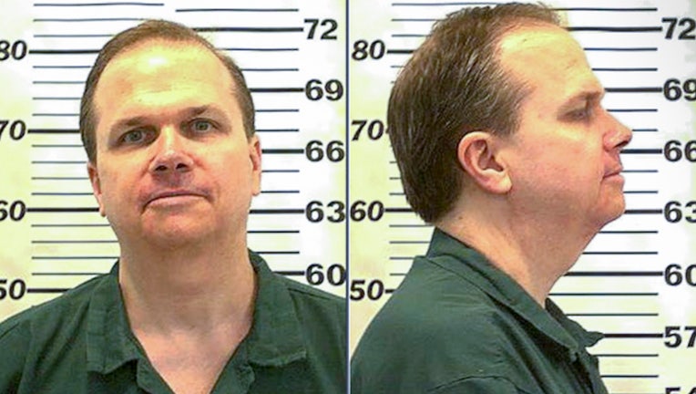 Photo: Mark David Chapman in a mug shot taken at the Attica Correctional Facility, July 2010.