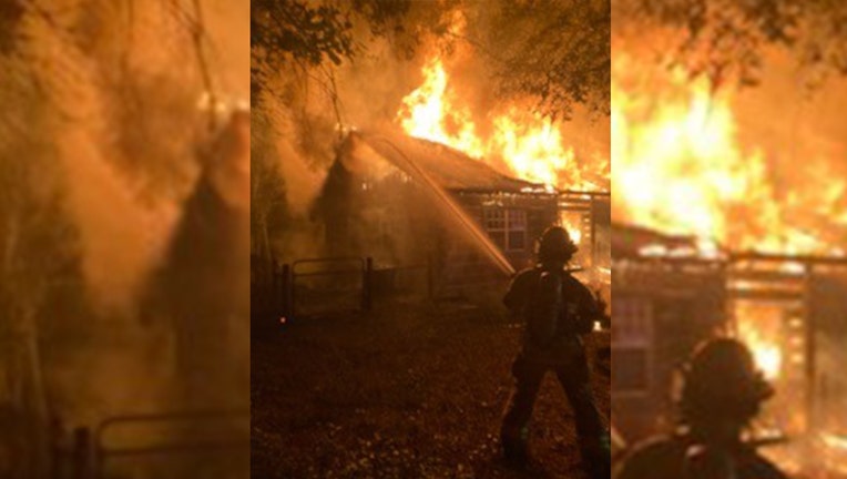 Photo: Flames and smoke rising from Brooksville home.