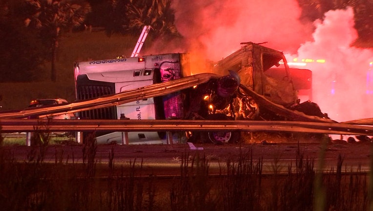 Photo: Smoke rises from tractor-trailer following crash on I-4 near Polk Parkway.