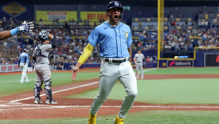 Jose Siri #22 of the Tampa Bay Rays celebrates scoring against the New York Yankees during the third inning of a baseball game at Tropicana Field on September 3, 2022 in St. Petersburg, Florida.