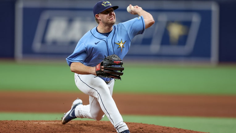 Garrett Cleavinger #60 of the Tampa Bay Rays pitches against the Toronto Blue Jays in the eighth inning during a baseball game at Tropicana Field on September 25, 2022 in St. Petersburg, Florida. 