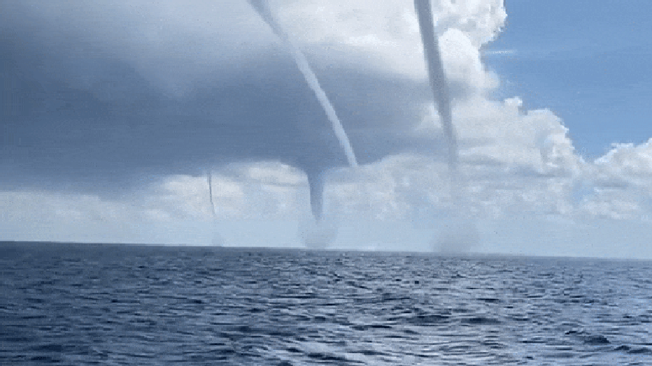 Photo: Four waterspouts spin off the Spanish island of Majorca on Sept. 16, 2022.